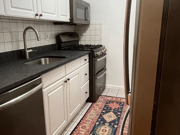 Kitchen with brand new granite countertops.