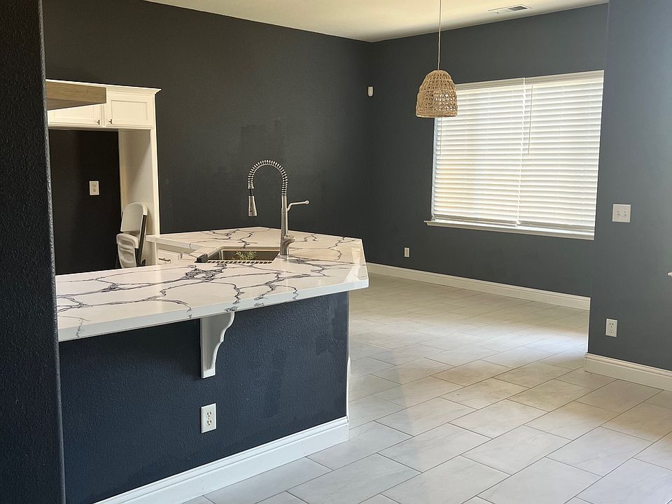 Breakfast Island with breakfast nook leading outside backyard.