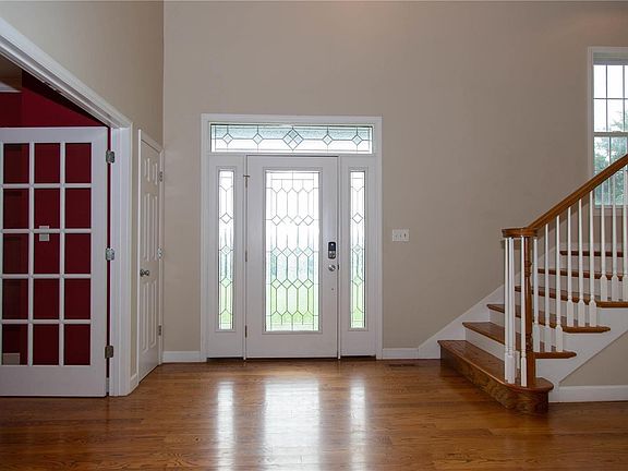 The 13 x 13 2-sty entry foyer. To the left is the dining room and the stairway leads to the upstairs.
