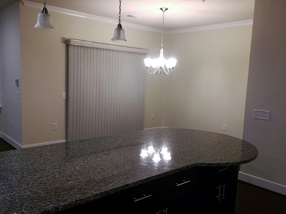 breakfast bar dining and balcony door shades