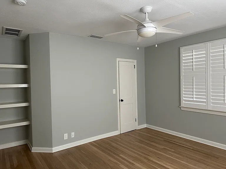 Bedroom 2 with built-in shelves is 13 ft 6 inches x 12 feet.