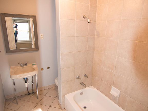 Tile Surround Tub and floor, pedestal sink