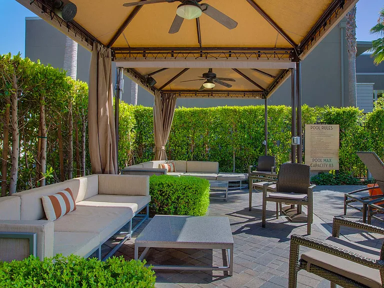 Leisure comes comfortably under the pool cabanas