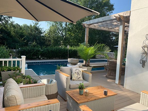 Jasmine surrounds fenced yar