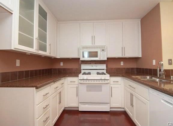Bright Kitchen with Granite Countertops and Newer Cabinets