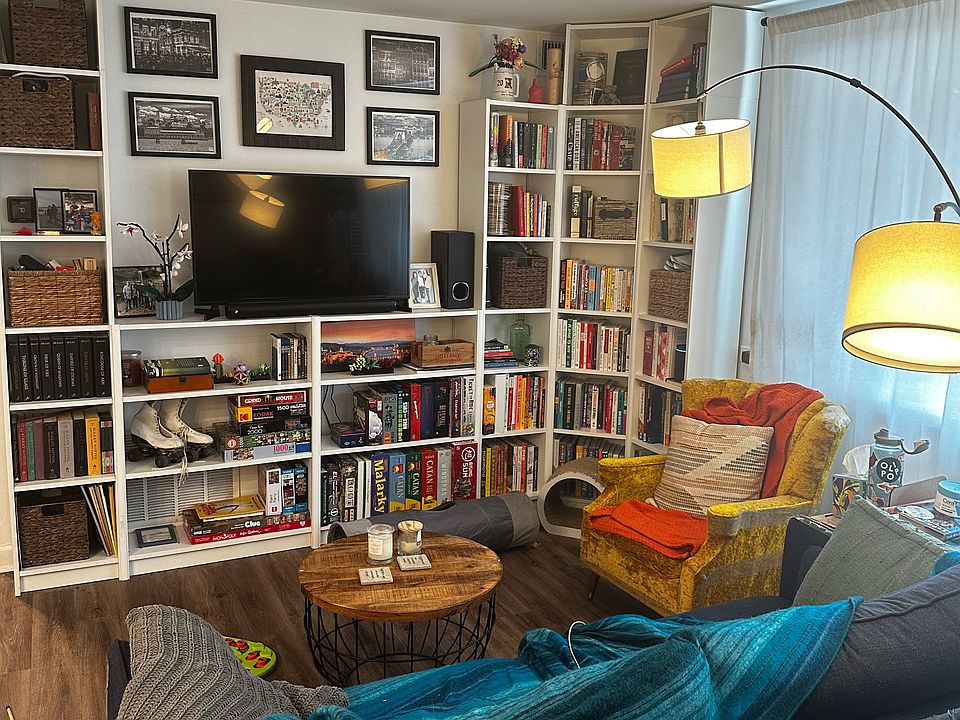 Living room with built in shelving. Can fit a 55" TV