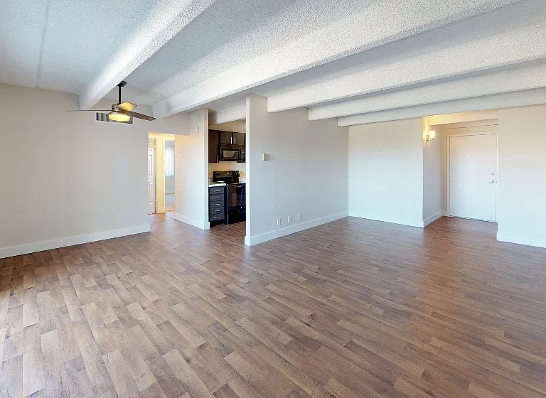 Large living and dining space with balcony access