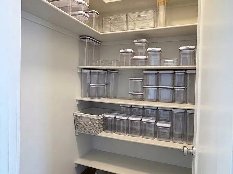 Walk in kitchen pantry with Oxo containers for food storage