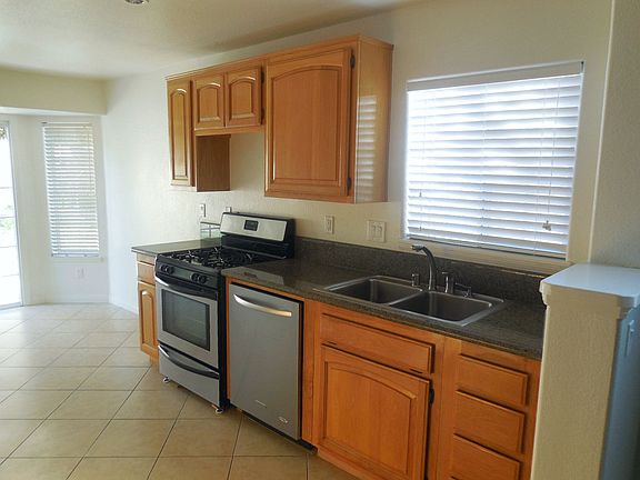 Spacious kitchen with a breakfast area, numerous cabinets