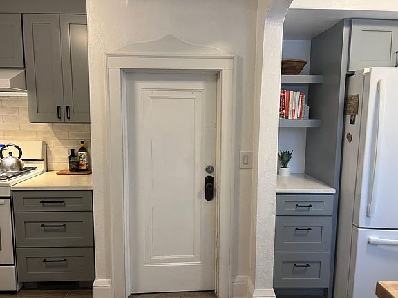Shared mud room and side door entrance through this door. Basement access as well.