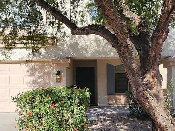 Front with shade tree