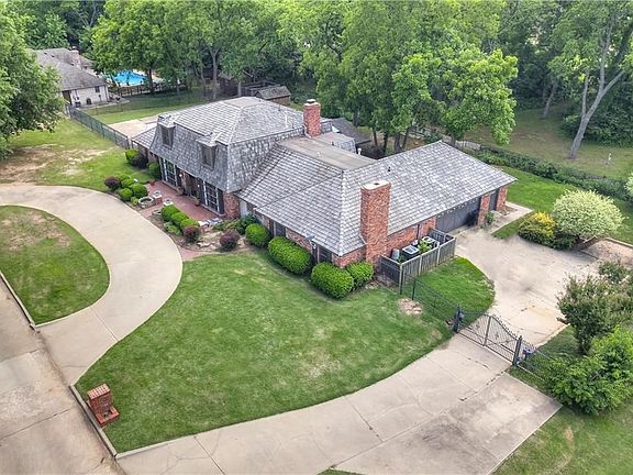 Yet another drone view.  Parking galore, the two-car garage has an attached shop that has plenty of room for all your projects.