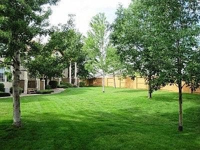 large grass area in front of condo