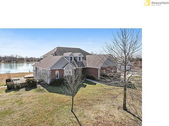 This meticulously maintained home sits on over 18 acres, with a 3 acre pond, in-ground pool, martini