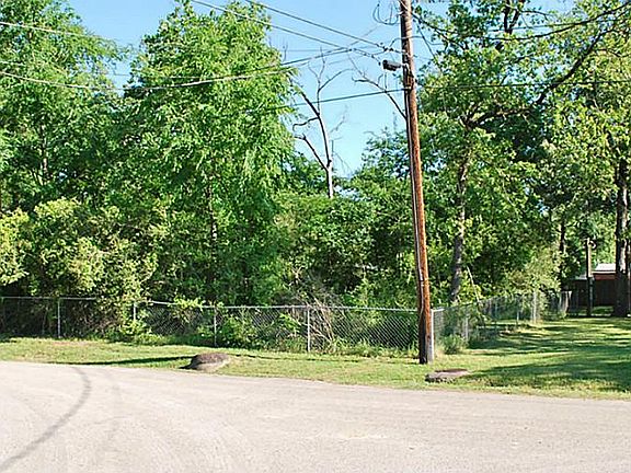 The lot to the left of the home is wooded
