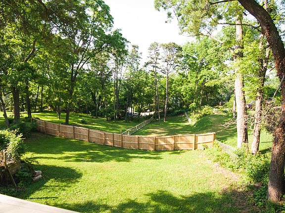 Backyard accessible from deck and parking spot.