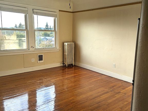 Beautifully restored hardwood floors, nice view of the community gardens!