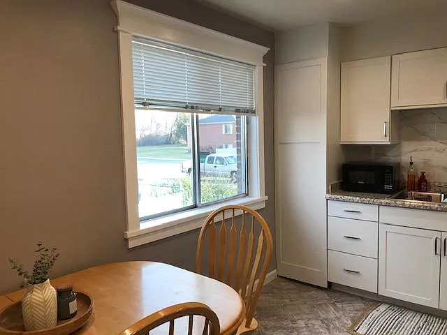 Furniture not included. Shown to show kitchen is spacious.
