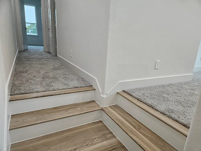 The stairwell splits at the top. Turn right for the Master Suite and the dedicated workspace. continue straight ahead for the two additional rooms and full bath.