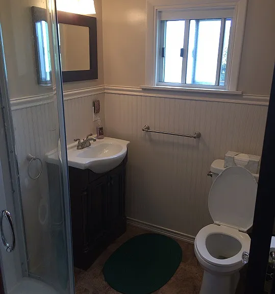 quaint bathroom with corner shower