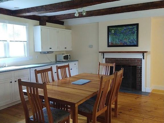 Kitchen table and fireplace.