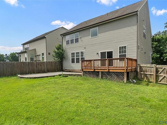Fenced yard with deck and patio