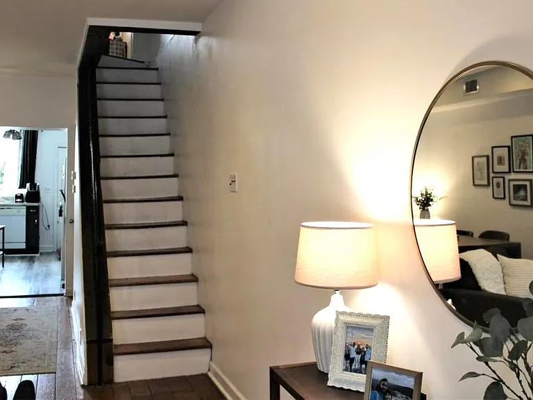 Living room showing stairs to second floor