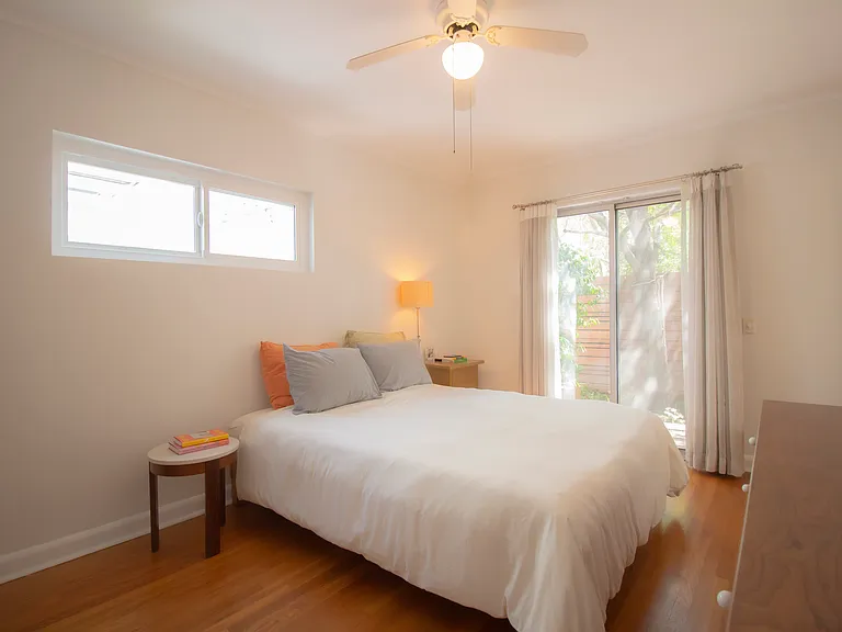 main bedroom with slider to back patio