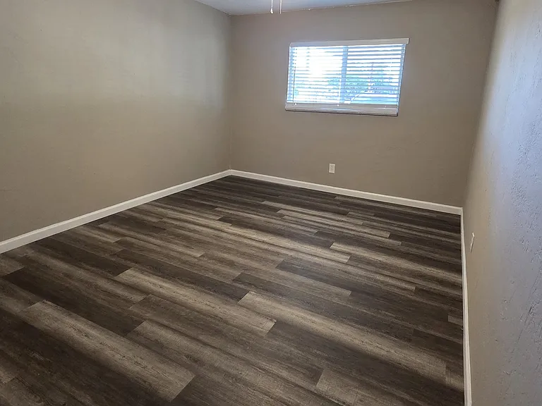 Another view of bedroom #2, includes cieling fan with lights