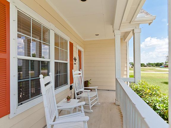 Just steps from the kitchen area, imagine your morning coffee on this beautiful front porch.