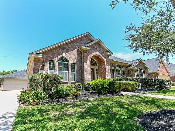 Check out the elongated driveway that leads to the detached two car garage, perfect for entertaining guests.