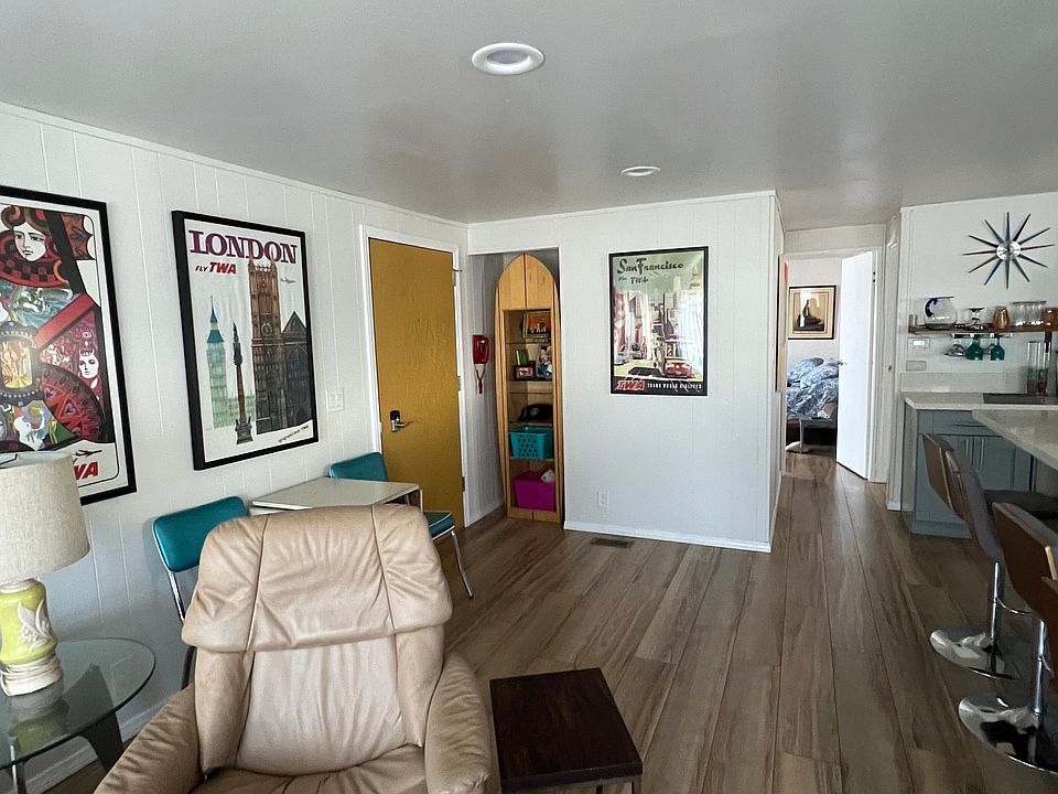 Showing short hallway to both bedrooms from living room.