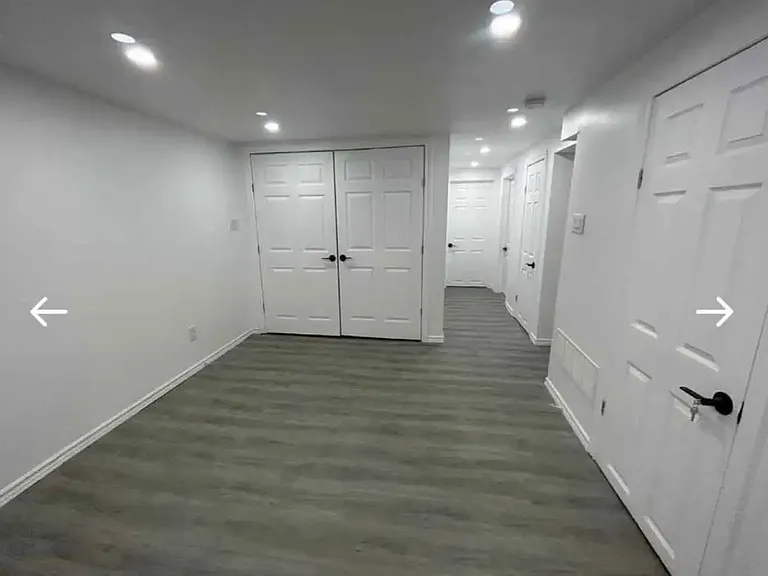 view from the kitchen and living room towards laundry room and hallway