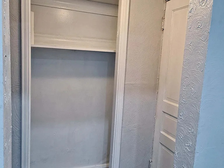 First floor storage, basement entry to the right