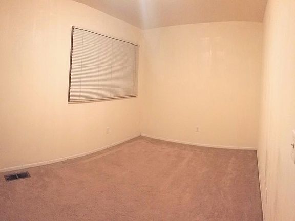 smaller bedroom of the two. Brand new carpet is not posted i