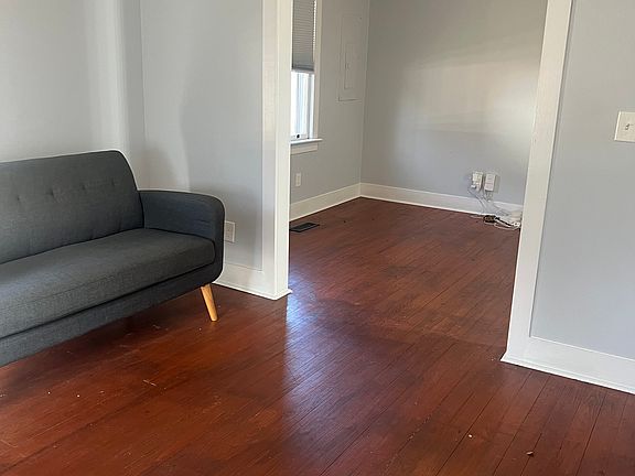 View of living room and dining room from front door.