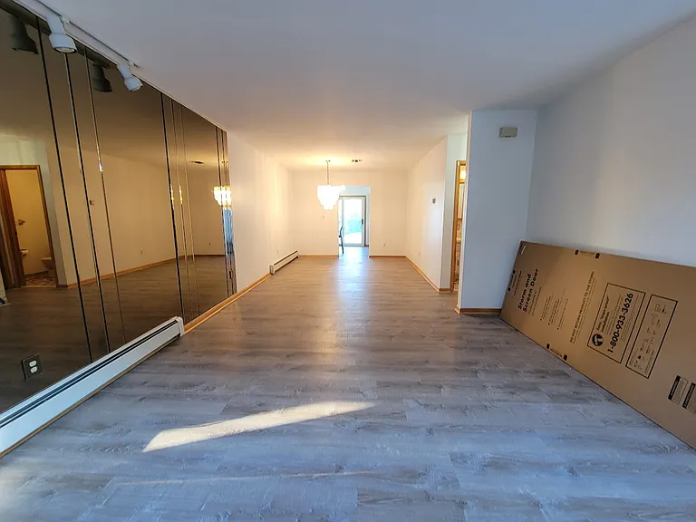 View From Living Room looking into Dining Room new flooring