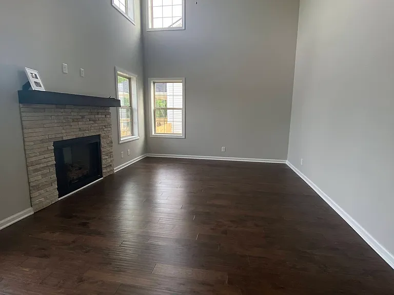 Living Room:
* 16 ft ceilings and gas fireplace (service not connected)
