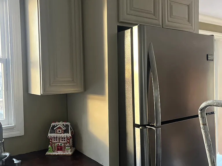 All wood cabinets with soft close doors and drawers, crown molding, built in refrigerator, stainless steel appliances, butcher block countertops