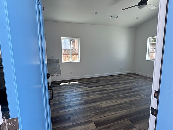 Front entry to living room. All rooms have ceiling fans with remotes.