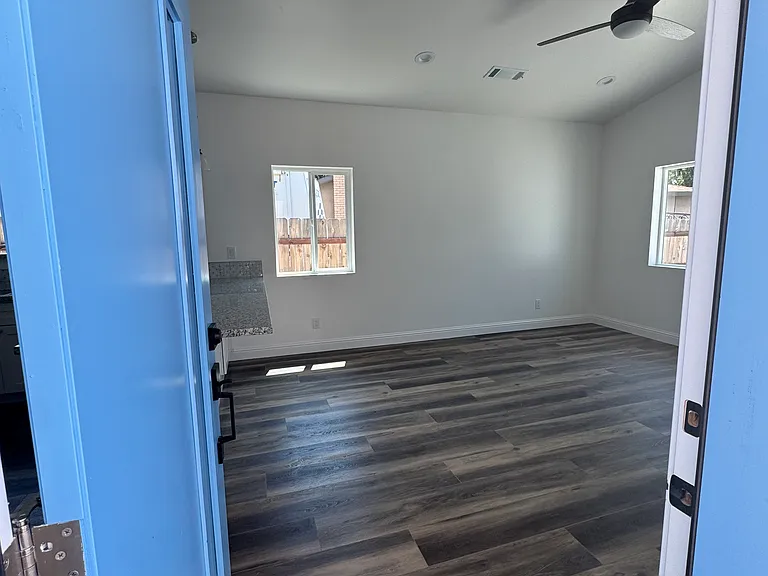 Front entry to living room. All rooms have ceiling fans with remotes.
