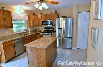 Kitchen with Island
						:
						Granite countertops and top of the line stainless steel appliances.