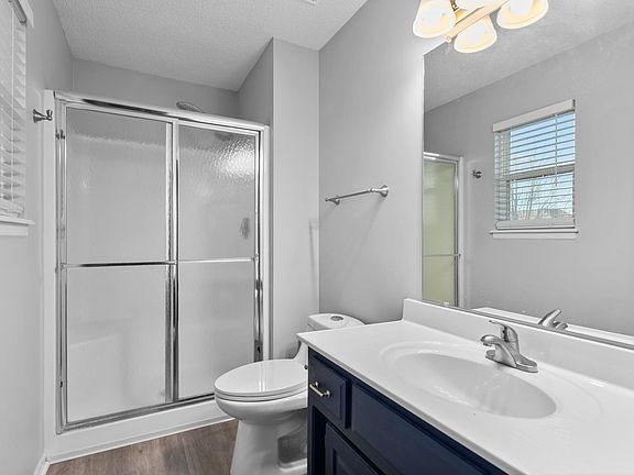 Master bathroom with custom shower head and new fixtures.