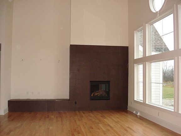 wood-look tile surrounds gas fireplace
