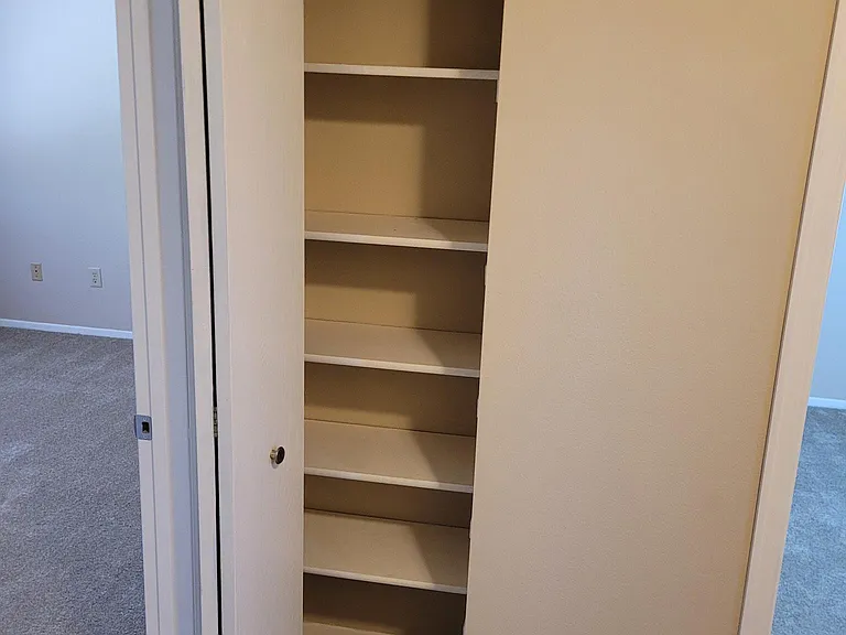 Linen closet between bedrooms