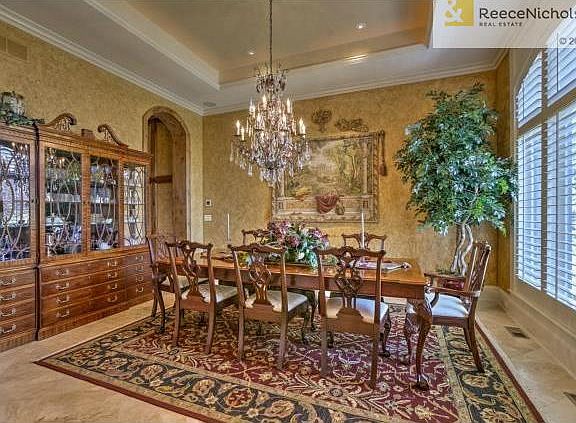 Dining room with vaulted ceiling and plantation shutters!