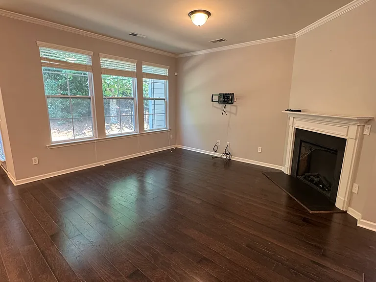 Living room has lots of windows!