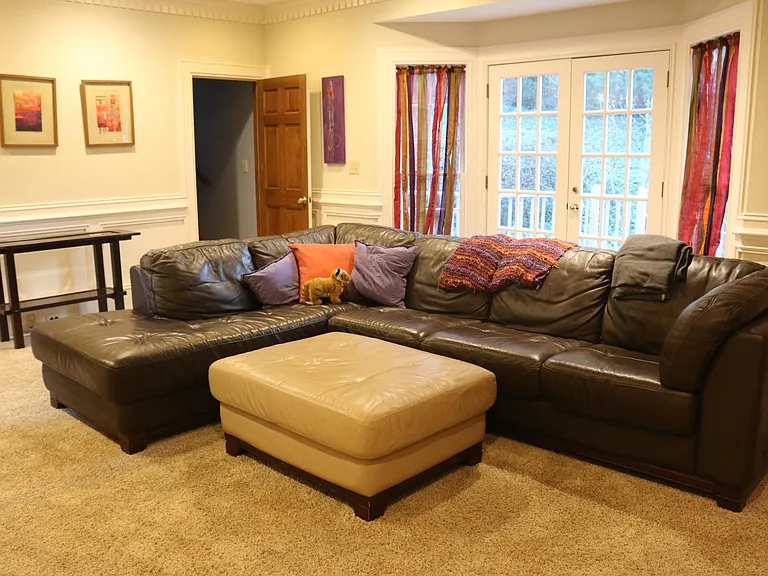 Family room w/wood-burning fireplace and built-ins.