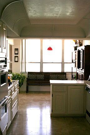 White open kitchen faces bay