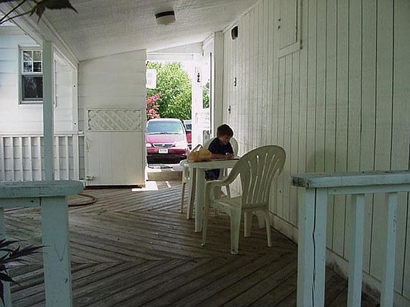 This back patio, deck, and breezeway is a great place for family gatherings or picnics.